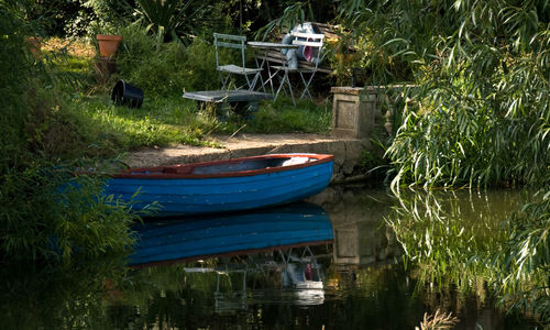 Boats moored in water