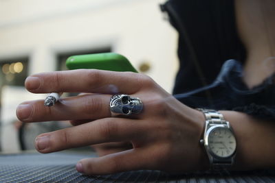 Close-up of woman hand with text