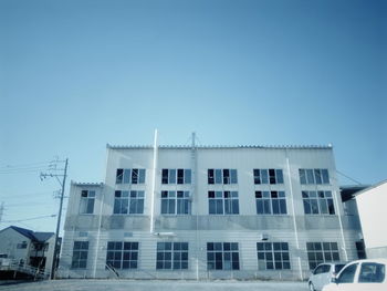 Low angle view of building against clear blue sky