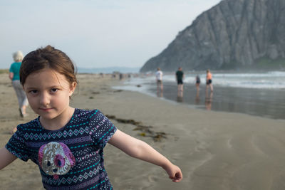 Portrait of girl standing at beach