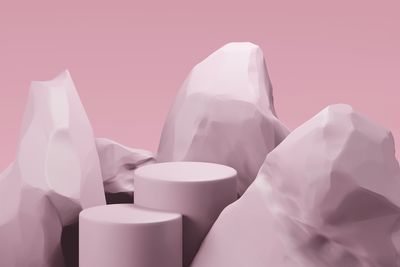 Close-up of electric lamp against pink background