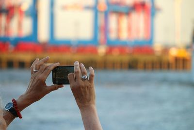 Man photographing with mobile phone