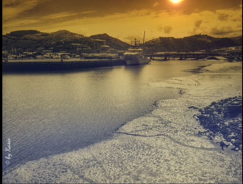 water, sunset, sky, built structure, architecture, river, reflection, cloud - sky, sea, building exterior, scenics, waterfront, beach, beauty in nature, tranquil scene, transfer print, transportation, auto post production filter, nature, tranquility