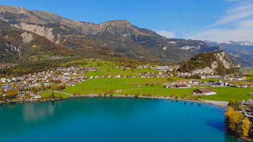 Scenic view of lake and mountains against sky