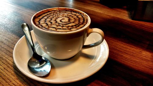 Close-up of coffee cup on table