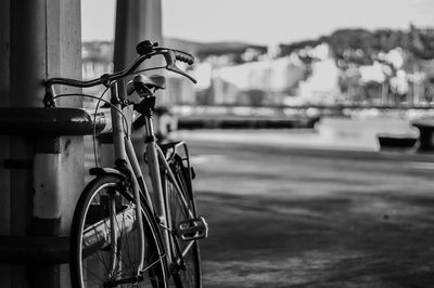 Close-up of bicycle parked against sky