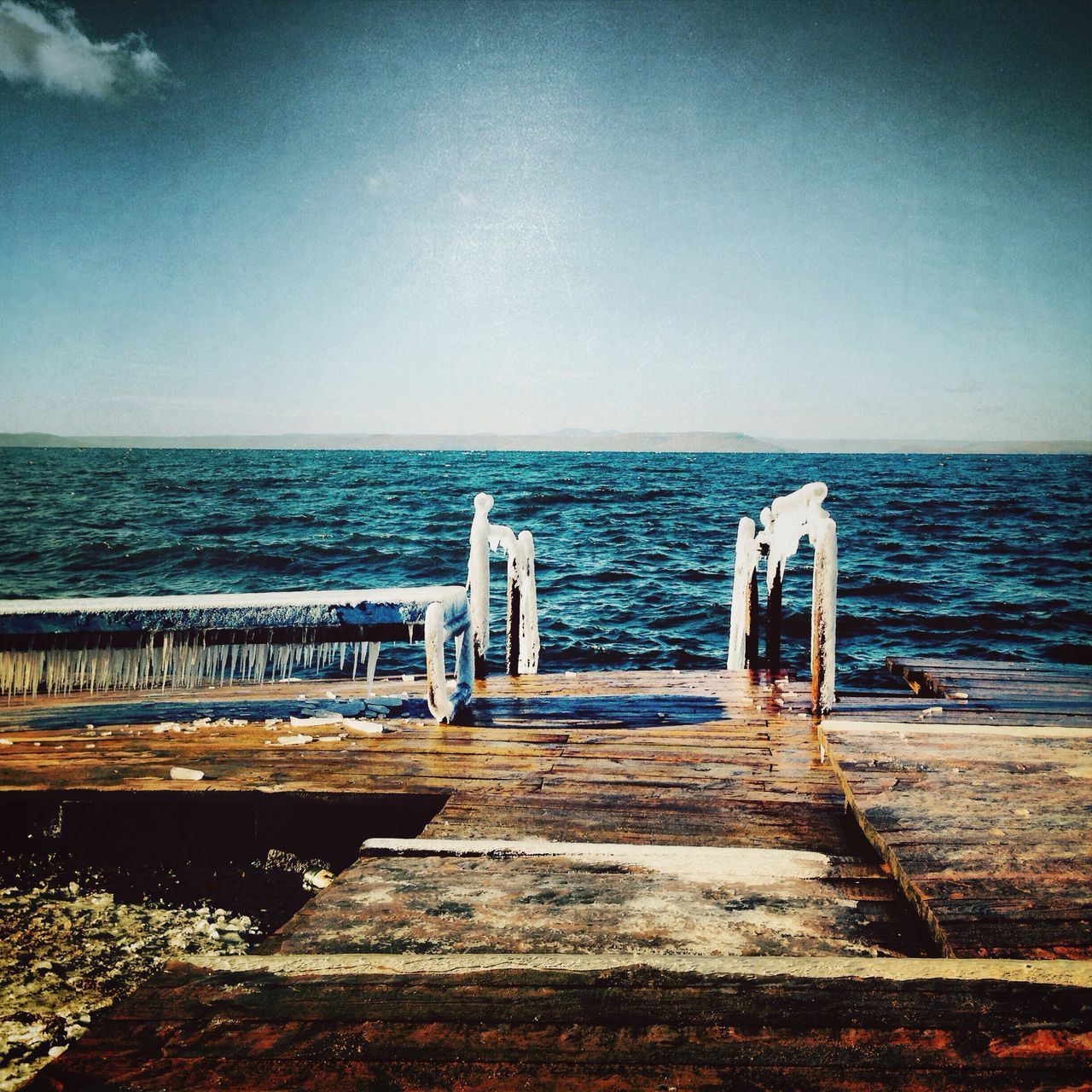 sea, water, horizon over water, tranquil scene, railing, pier, tranquility, scenics, the way forward, beauty in nature, blue, sky, nature, idyllic, beach, wood - material, jetty, clear sky, day, diminishing perspective