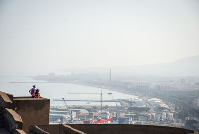 Rear view of couple standing on rooftop