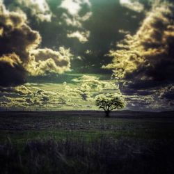 Scenic view of landscape against cloudy sky