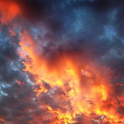 Low angle view of cloudy sky at sunset