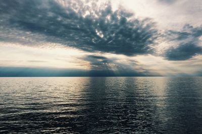 Scenic view of sea against sky at sunset