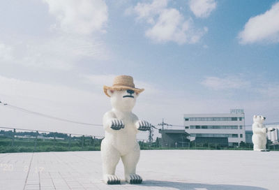 Statue of city against sky