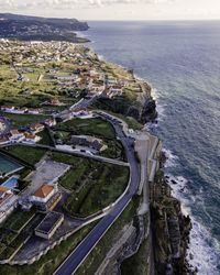 High angle view of buildings by sea