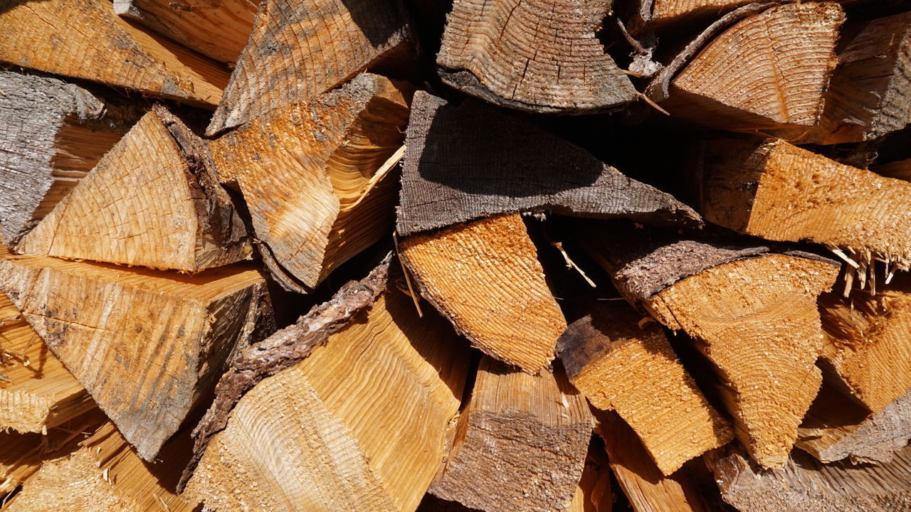 FULL FRAME SHOT OF FIREWOOD STACKED