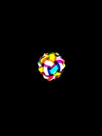 Close-up of multi colored pencils over black background