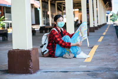 Portrait of woman sitting outdoors