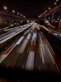 High angle view of light trails on highway at night