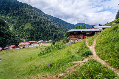 Panoramic shot of building and mountains against sky