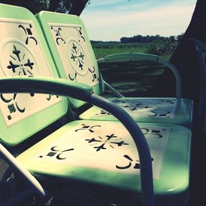 Close-up of part of train against sky