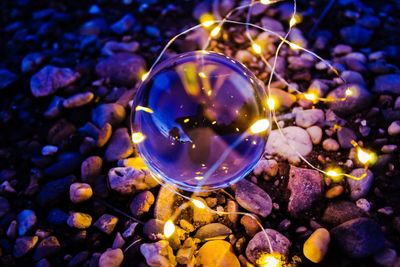 Close-up of crystal ball on stones