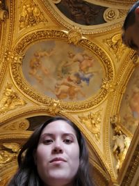 Portrait of young woman looking up