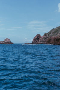 Scenic view of sea against blue sky