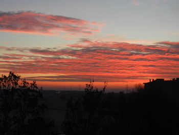 Scenic view of landscape against sky during sunset