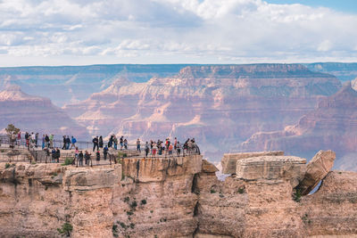 People on cliff at grand canyon