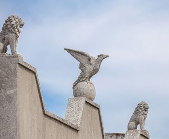 Low angle view of statue against sky