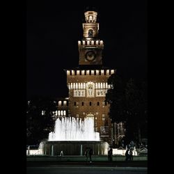 Low angle view of building against sky at night