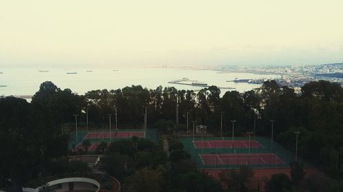 High angle view of trees and buildings against sky