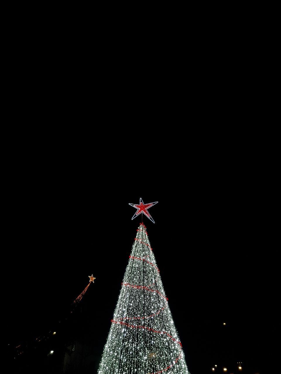 ILLUMINATED CHRISTMAS TREE AGAINST SKY AT NIGHT DURING FESTIVAL