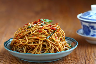 Close-up of noodles on plate on table