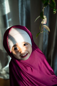 Portrait of cute girl at home