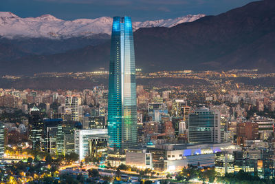 Aerial view of illuminated buildings in city at night