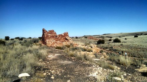 Scenic view of landscape against clear blue sky