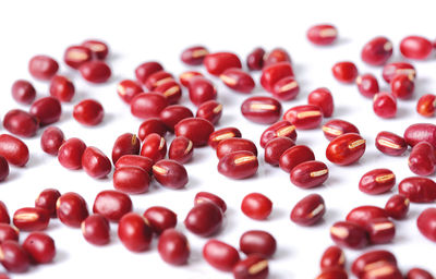 High angle view of candies against white background