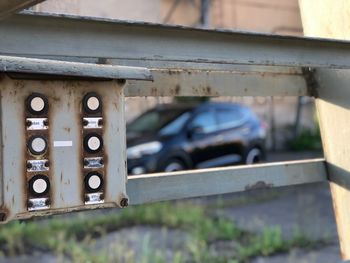 Close-up of old car on wall