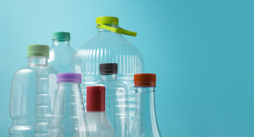 Close-up of bottle against blue background