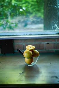 Fruits in glass on table