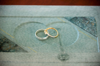 High angle view of wedding rings