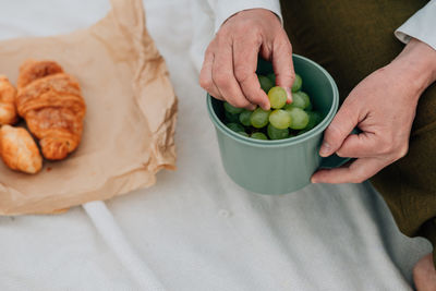 Midsection of man preparing food