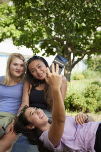 Happy young women taking selfie