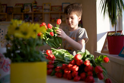 Boy holding flower bouquet