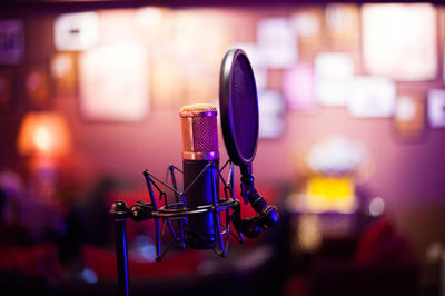 Close-up of microphone in illuminated room