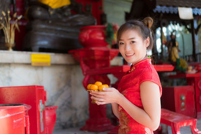 Portrait of smiling young woman