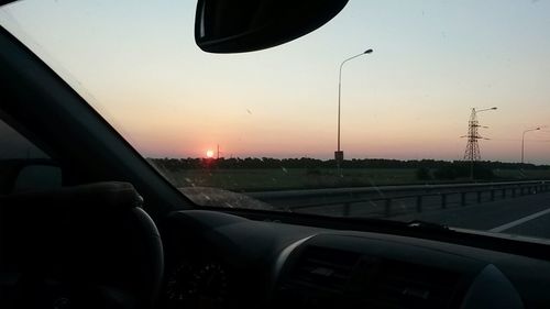 Sunset seen through train windshield