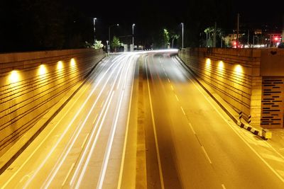 High angle view of light trails on road at night