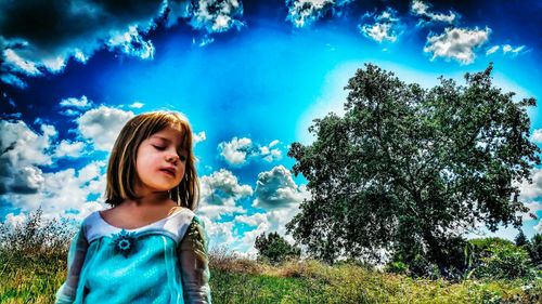 Portrait of a young woman against clear sky