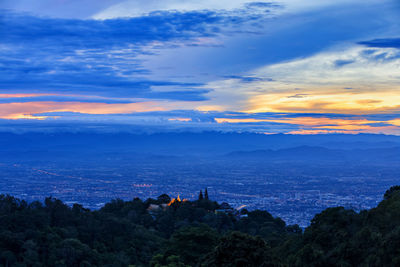 Scenic view of mountains against sky at sunset